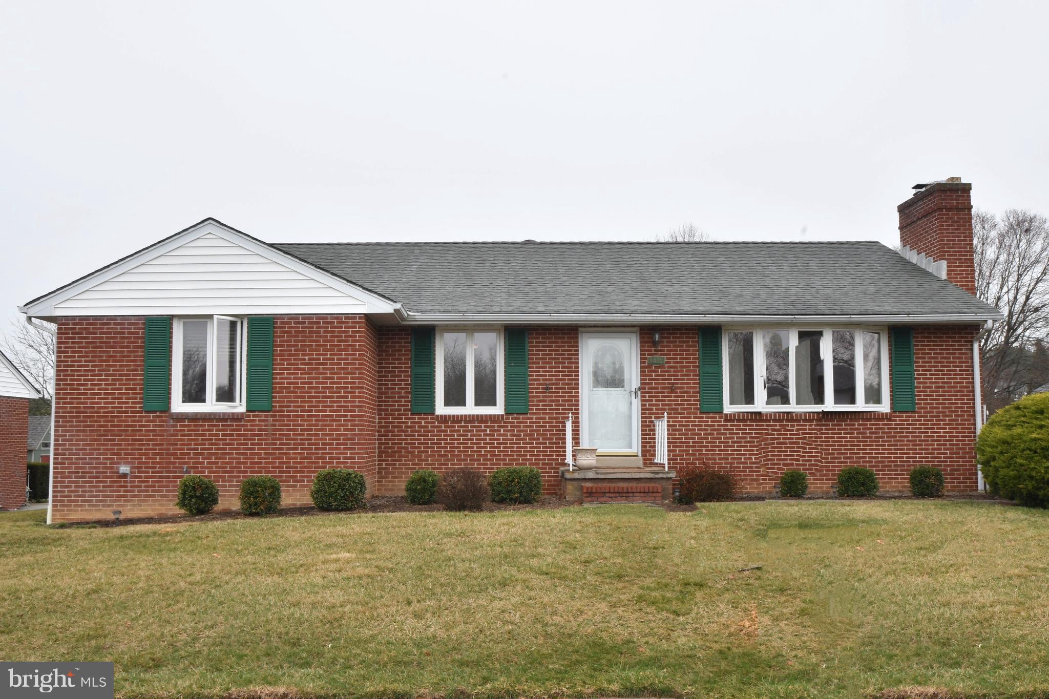 9412 Dawnvale Road Baltimore, MD 21236 - Photo 26 of 28 a front view of a house with a garden
