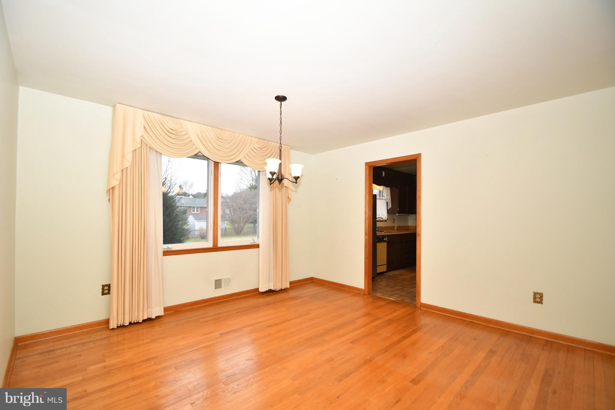 9412 Dawnvale Road Baltimore, MD 21236 - Photo 9 of 28 a view of empty room with window