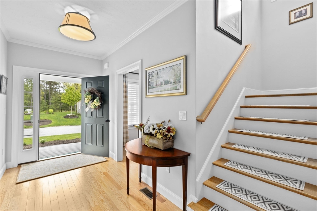 31 Farm Road Plymouth, MA 02360 - Photo 2 of 37 a view of an entryway with wooden floor and window
