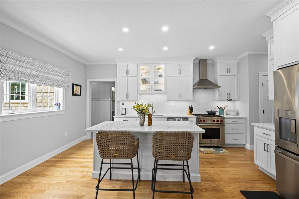 31 Farm Road Plymouth, MA 02360 - Photo 6 of 37 a kitchen with stainless steel appliances granite countertop a dining table chairs stove refrigerator and cabinets