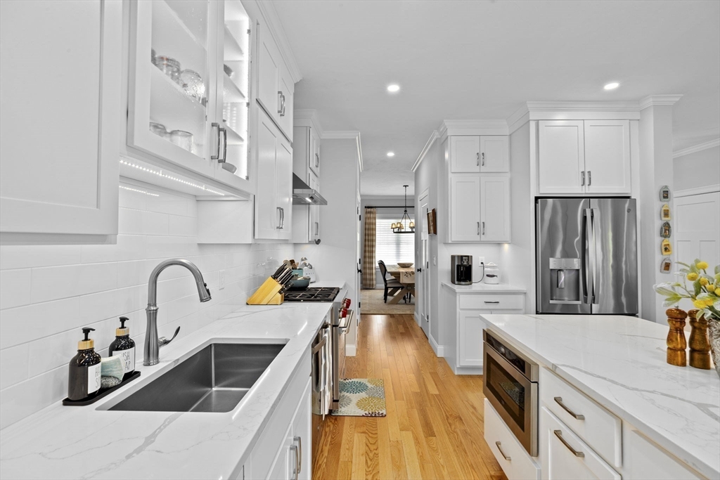 31 Farm Road Plymouth, MA 02360 - Photo 8 of 37 a kitchen with large cabinets a sink a counter and stainless steel appliances