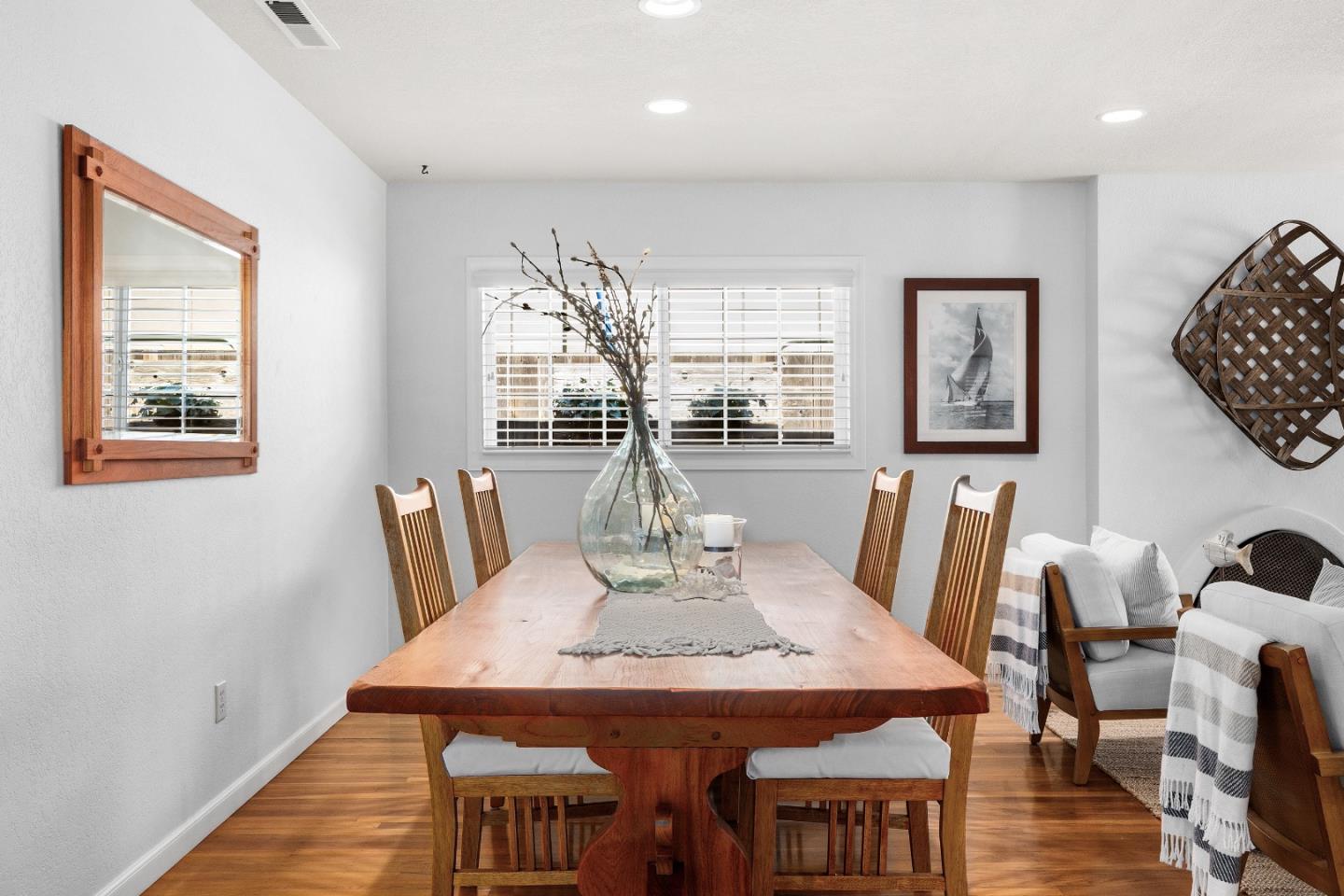 105 Wesley Street Capitola, CA 95010 - Photo 13 of 55 a view of a dining room with furniture window and wooden floor
