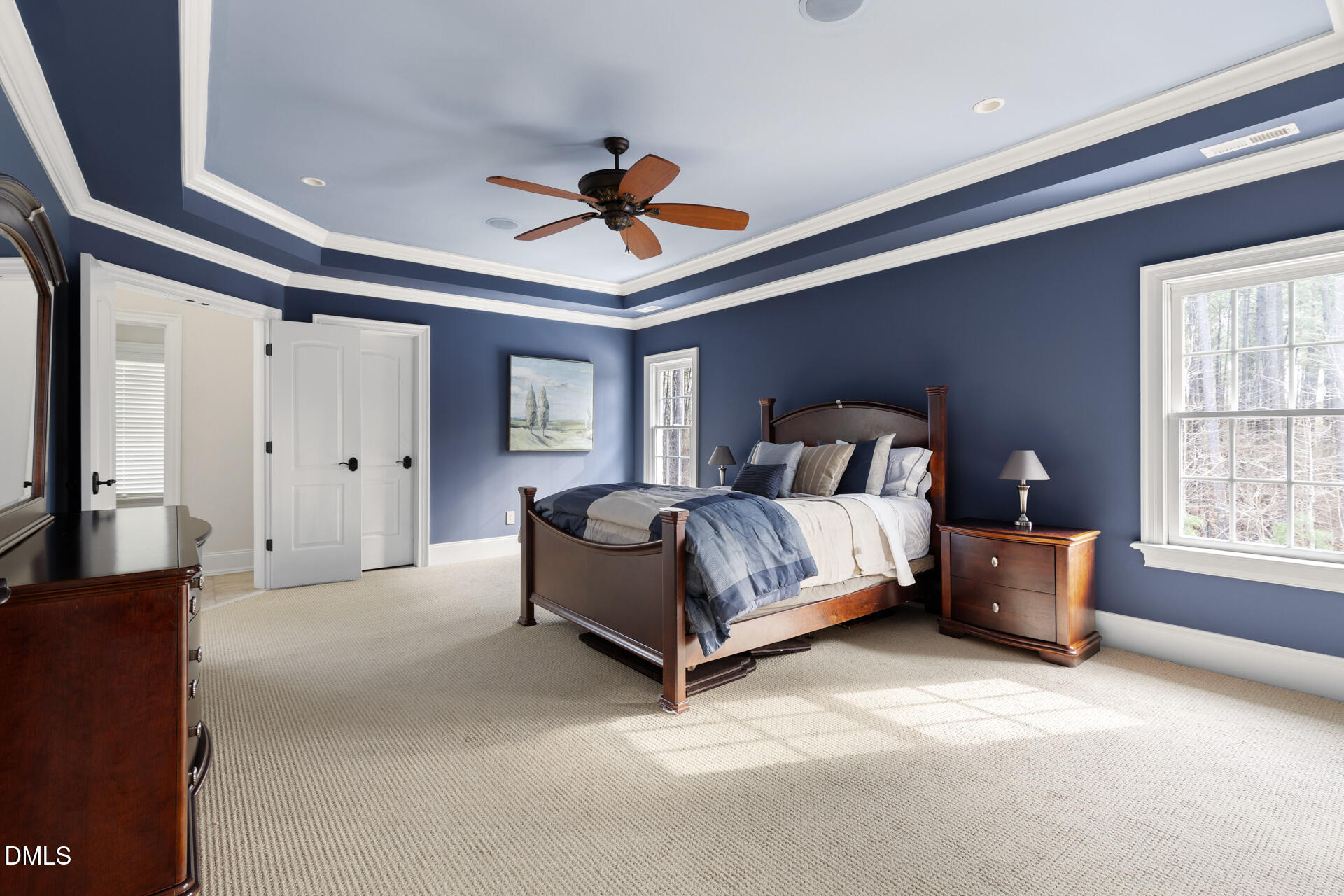 112 Winding Ridge Road Durham, NC 27713 - Photo 52 of 84 a spacious bedroom with a bed couch and a window