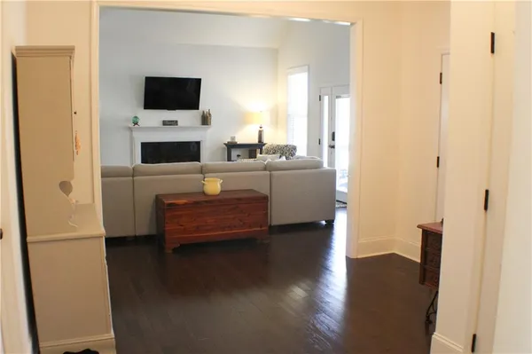 a view of living room with furniture and flat screen tv