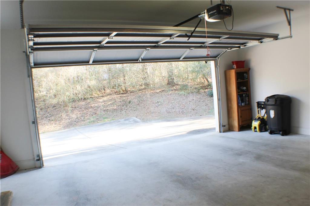 1175 Diamond Hill Colbert Road Colbert, GA 30628 - Photo 15 of 27 a view of a room with wooden floor and windows