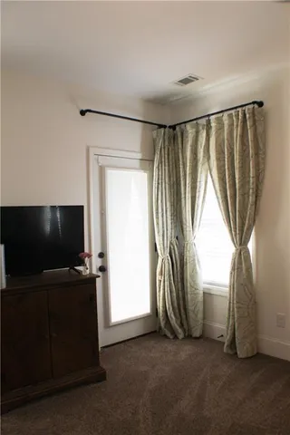 a view of livingroom with hardwood floor and workspace