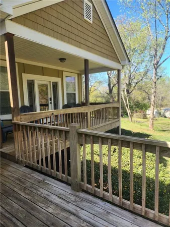 a view of a brick house with large windows