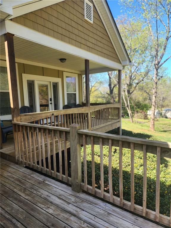 1175 Diamond Hill Colbert Road Colbert, GA 30628 - Photo 2 of 45 a view of a brick house with large windows