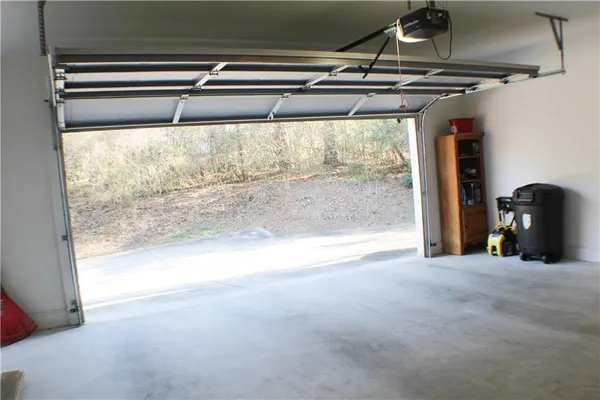 a view of a room with wooden floor and windows