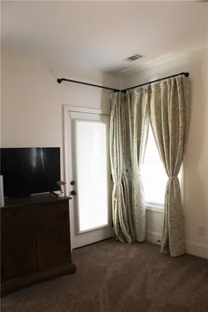a view of livingroom with hardwood floor and workspace