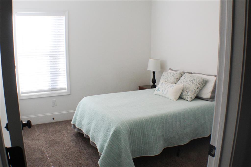 1175 Diamond Hill Colbert Road Colbert, GA 30628 - Photo 27 of 27 a bedroom with a bed and window