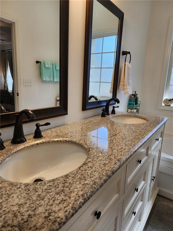 1175 Diamond Hill Colbert Road Colbert, GA 30628 - Photo 28 of 45 a bathroom with a granite countertop sink and a mirror