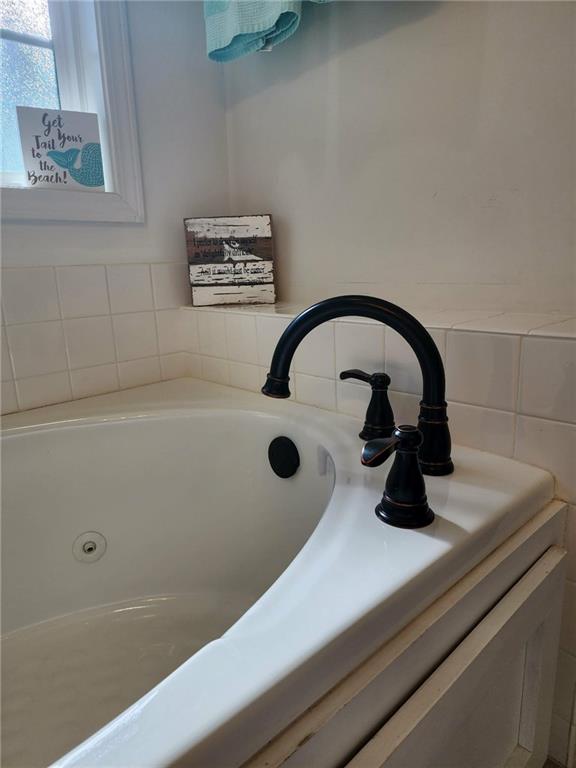 1175 Diamond Hill Colbert Road Colbert, GA 30628 - Photo 33 of 45 a close view of a sink a faucet and window in the bathroom