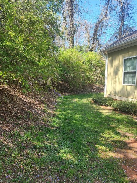 1175 Diamond Hill Colbert Road Colbert, GA 30628 - Photo 42 of 45 a backyard of a house with lots of green space