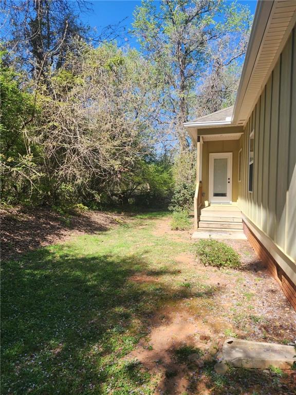 1175 Diamond Hill Colbert Road Colbert, GA 30628 - Photo 44 of 45 a view of a house with a yard