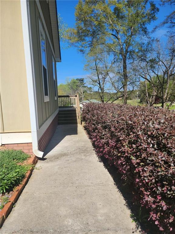 1175 Diamond Hill Colbert Road Colbert, GA 30628 - Photo 5 of 45 a view of a pathway both side of house with yard