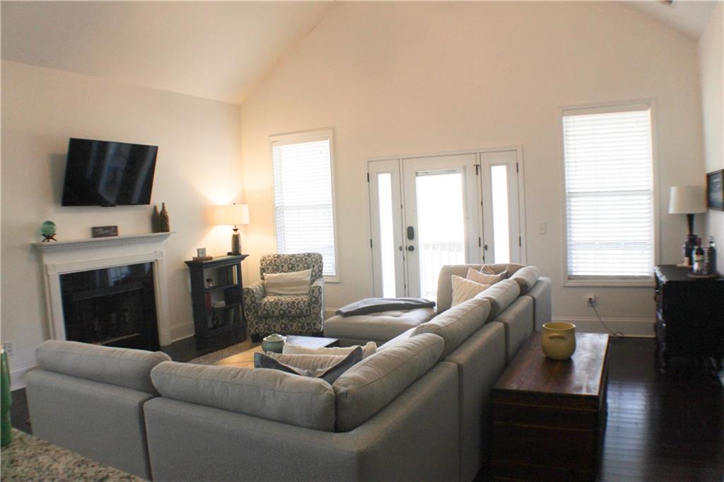 1175 Diamond Hill Colbert Road Colbert, GA 30628 - Photo 7 of 27 a living room with furniture a flat screen tv and a fireplace