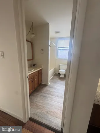 a view of a bathroom from the hallway