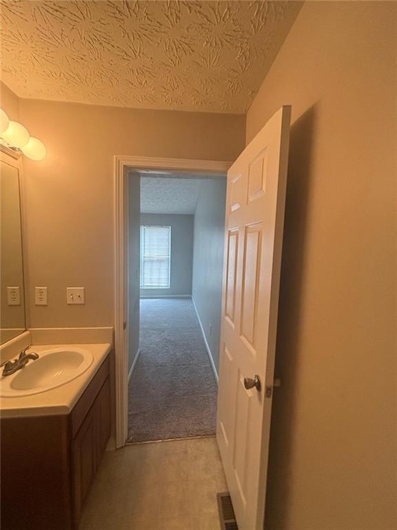 6242 Redan Overlook Lithonia, GA 30058 - Photo 11 of 17 a bathroom with a sink and a mirror