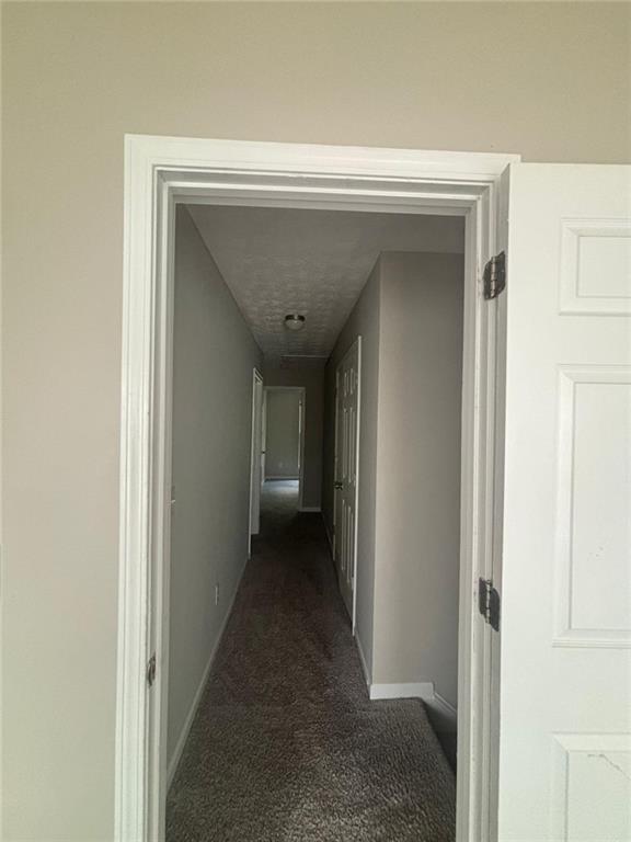 6242 Redan Overlook Lithonia, GA 30058 - Photo 15 of 17 a view of a hallway with wooden shelves