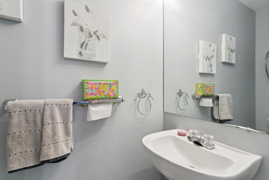 707 Gazebo Circle, Unit 707 Reading, MA 01867 - Photo 11 of 41 a bathroom with a sink mirror and vanity