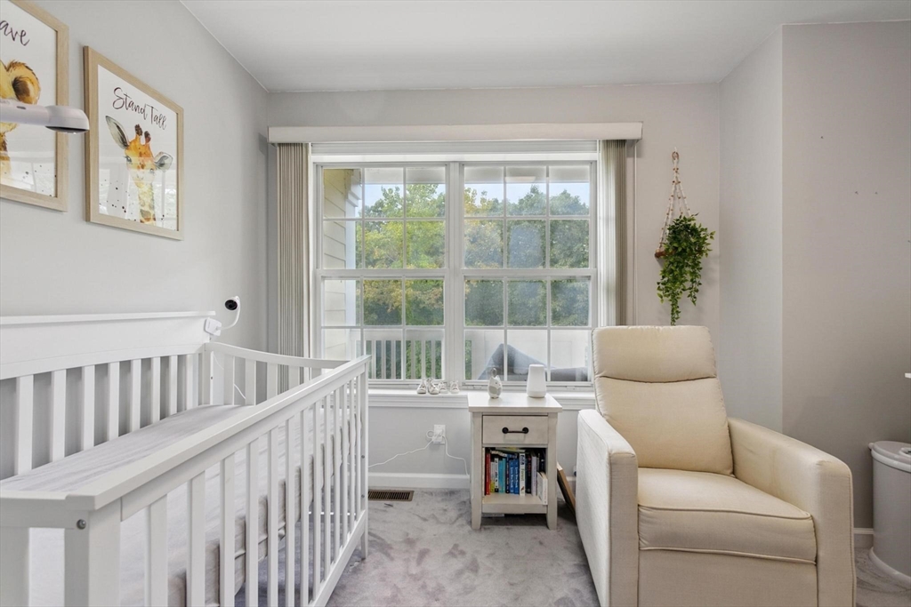 707 Gazebo Circle, Unit 707 Reading, MA 01867 - Photo 16 of 41 a bedroom with furniture and a window