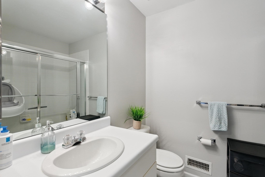 707 Gazebo Circle, Unit 707 Reading, MA 01867 - Photo 17 of 41 a bathroom with a sink toilet and shower