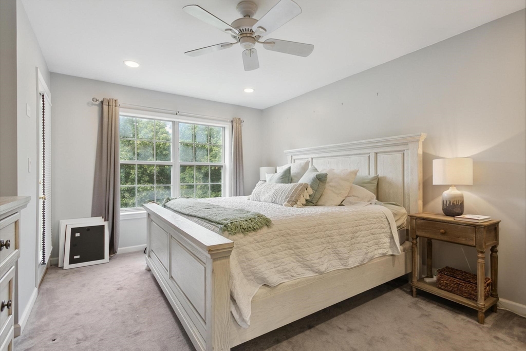 707 Gazebo Circle, Unit 707 Reading, MA 01867 - Photo 19 of 41 a bedroom with a bed and a window