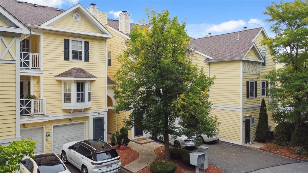 707 Gazebo Circle, Unit 707 Reading, MA 01867 - Photo 2 of 41 a front view of a house with garden