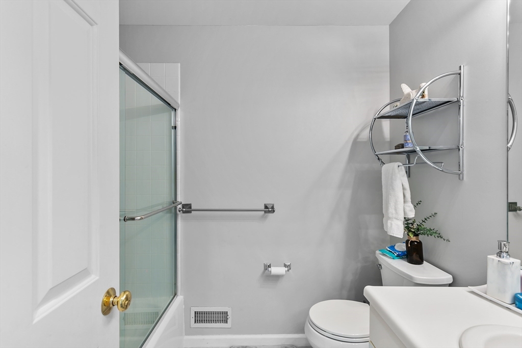 707 Gazebo Circle, Unit 707 Reading, MA 01867 - Photo 21 of 41 a white toilet sitting next to a bath tub