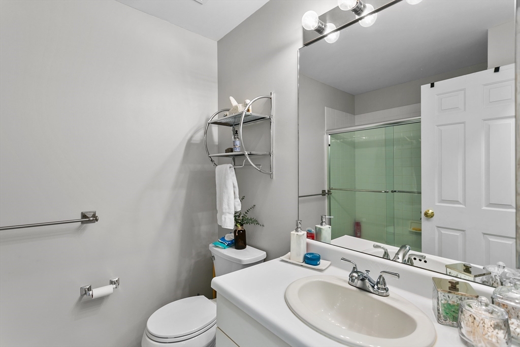 707 Gazebo Circle, Unit 707 Reading, MA 01867 - Photo 22 of 41 a bathroom with a sink toilet and mirror