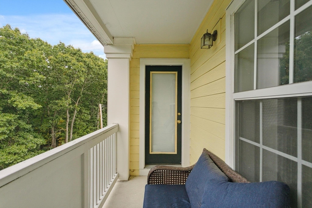 707 Gazebo Circle, Unit 707 Reading, MA 01867 - Photo 24 of 41 a view of balcony with furniture