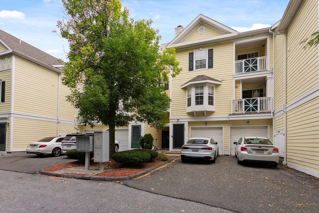 707 Gazebo Circle, Unit 707 Reading, MA 01867 - Photo 28 of 41 a car parked in front of a house