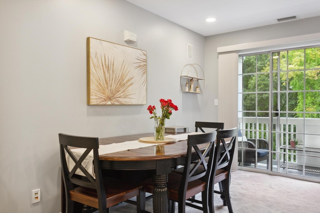 707 Gazebo Circle, Unit 707 Reading, MA 01867 - Photo 5 of 41 a view of a dining room with furniture window and outside view