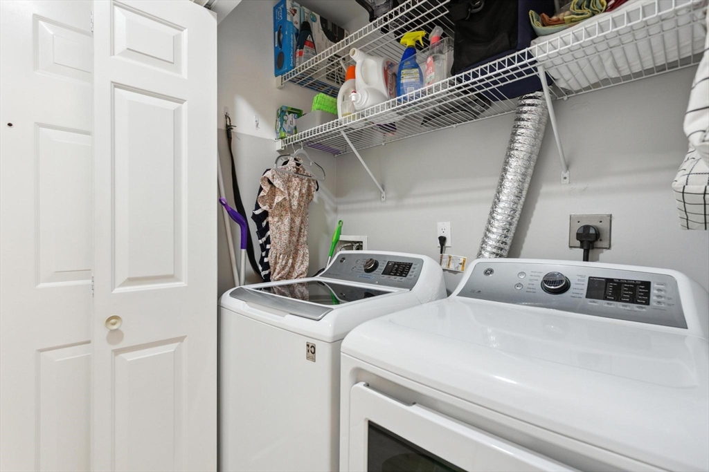 707 Gazebo Circle, Unit 707 Reading, MA 01867 - Photo 10 of 41 a utility room with dryer and washer