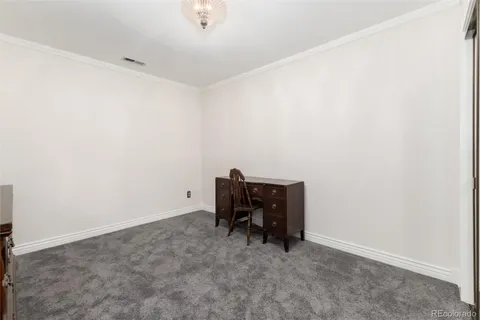 a view of an empty room and chair