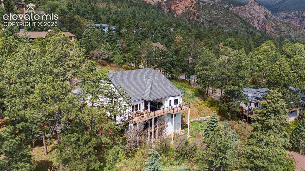 21 Leaming Road Colorado Springs, CO 80906 - Photo 8 of 48 White-sided residence with dark gray roofing