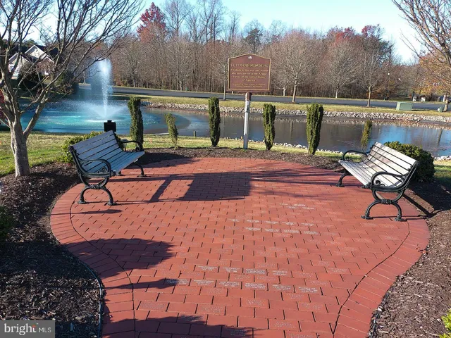 a view of a backyard with sitting area