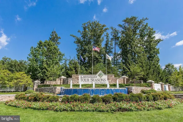 a view of a garden with lawn chairs