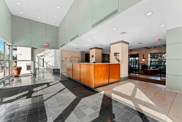 a lobby with furniture and window