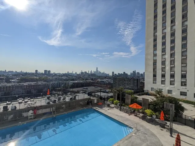 a swimming pool with chairs