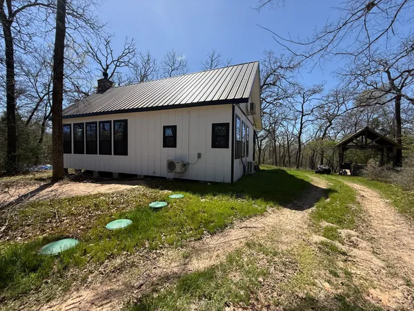 a view of house with yard