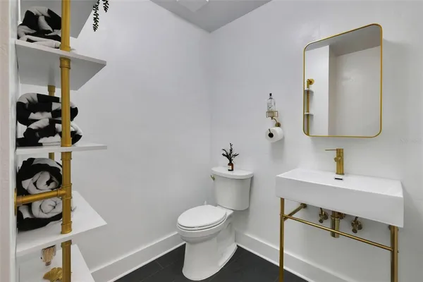 a kitchen with stainless steel appliances a stove sink and cabinets