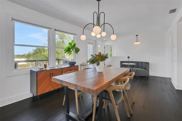 a kitchen with stainless steel appliances white cabinets and a refrigerator