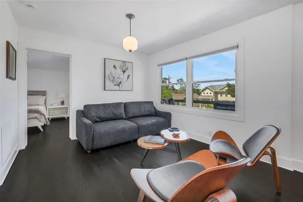 a open kitchen with a sink and large window