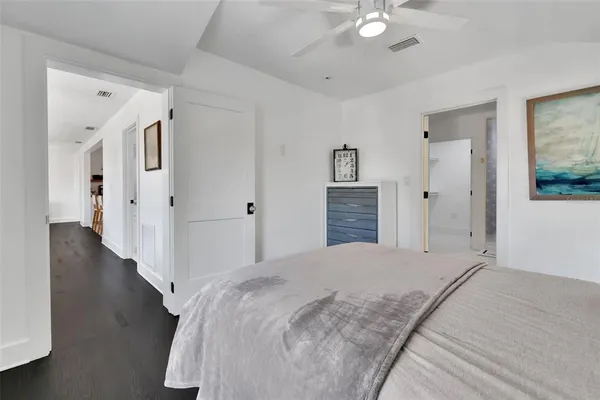 a bedroom with a bed and a dresser