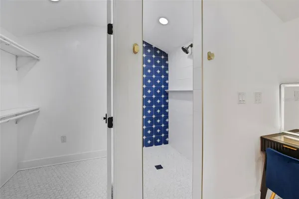 a view of an empty room with a cabinet