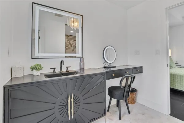 a living room with furniture and a dining table