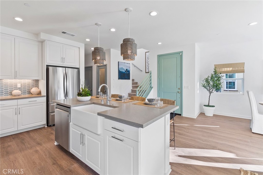 12352 Van Gogh Place Yucaipa, CA 92399 - Photo 16 of 44 a kitchen with a sink stove and refrigerator