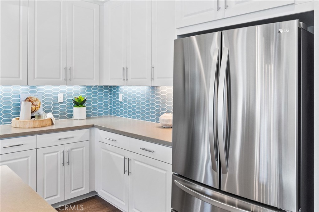 12352 Van Gogh Place Yucaipa, CA 92399 - Photo 21 of 44 a kitchen with white cabinets and sink